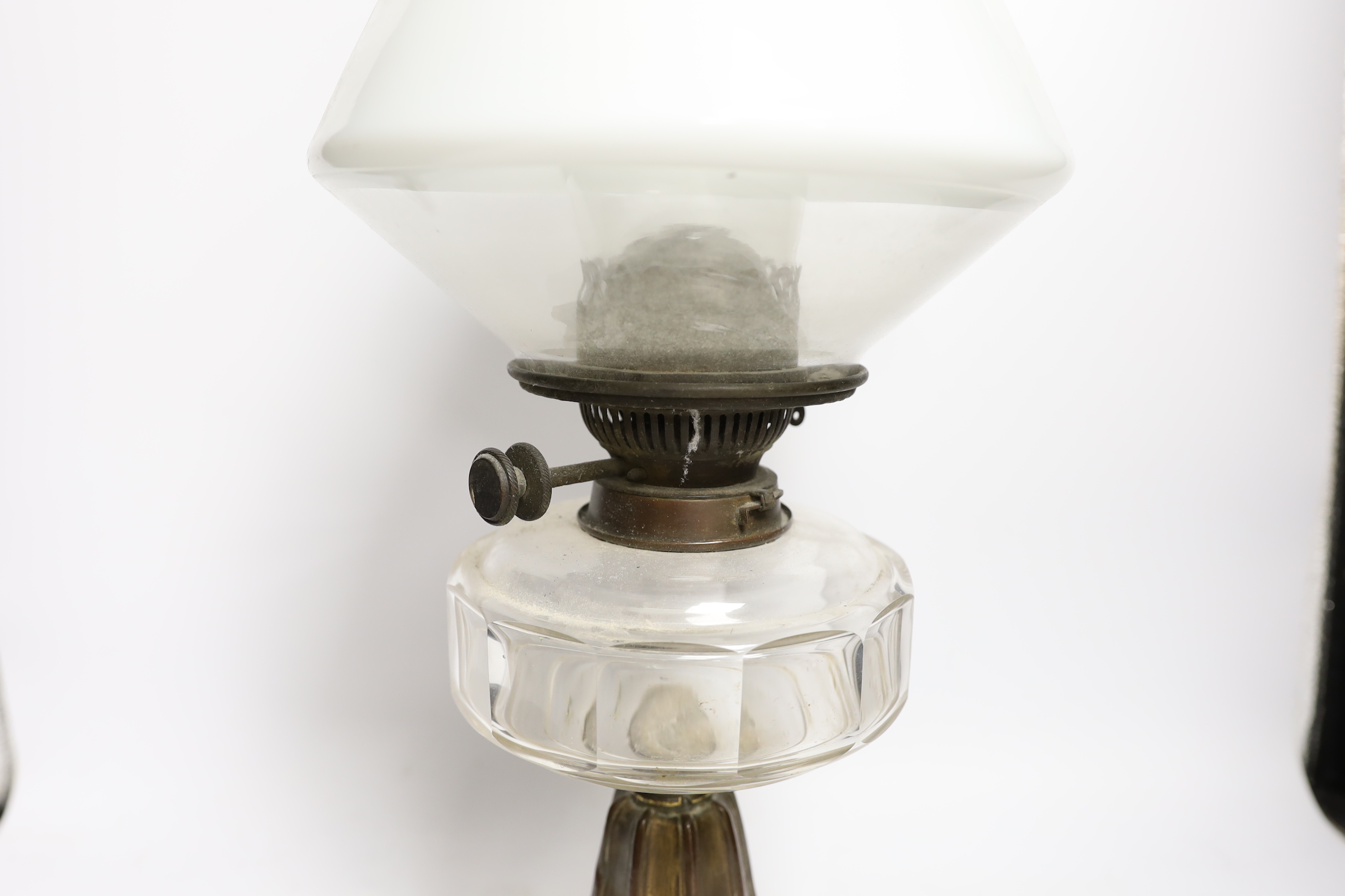 A Victorian brass stemmed oil lamp, with white glass shade, 54cm high including funnel